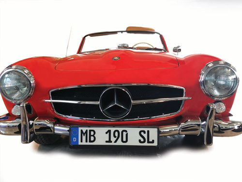 The exterior of this cherry red Mercedes is something to not be missed, but the interior is just as eye-catching! How fun would it be to drive this down the freeway on a warm summer day...