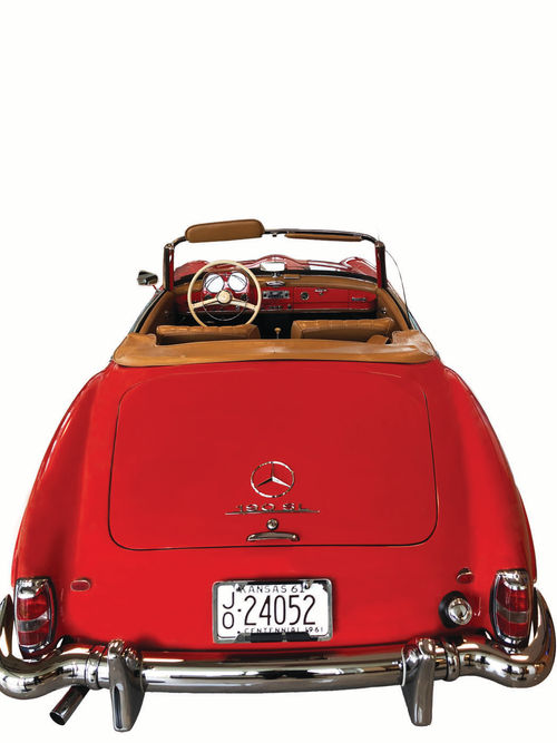 The exterior of this cherry red Mercedes is something to not be missed, but the interior is just as eye-catching! How fun would it be to drive this down the freeway on a warm summer day...