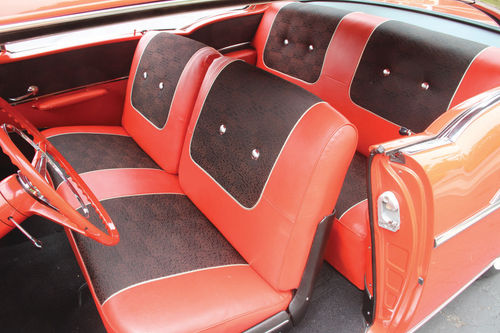 The familiar red and black Bel Air interior had a front seat the size of a couch.