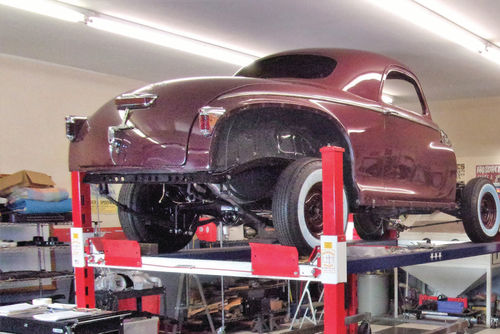 Here’s another view of the springs and shackles after dropping the body, doors and trunk lid on the restored chassis. As more weight is added, the springs can flatten out even more.