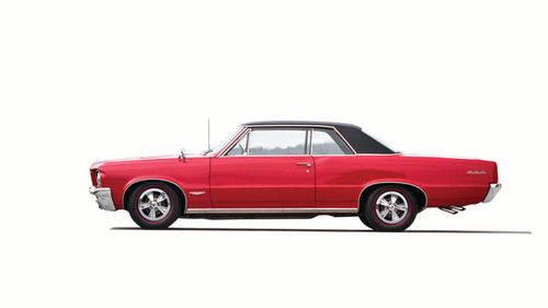 A reader wants the paint on his ivory 1964 GTO to look as good as the finish on this red Goat.