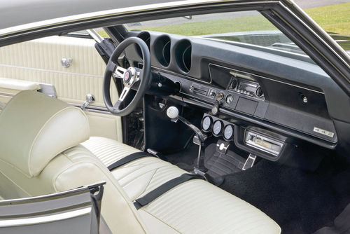 The steering wheel is, obviously, a later aftermarket piece, but the eight-track tape-player to its right is correct.