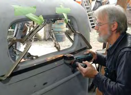 Using a cut off wheel to remove cab rear window