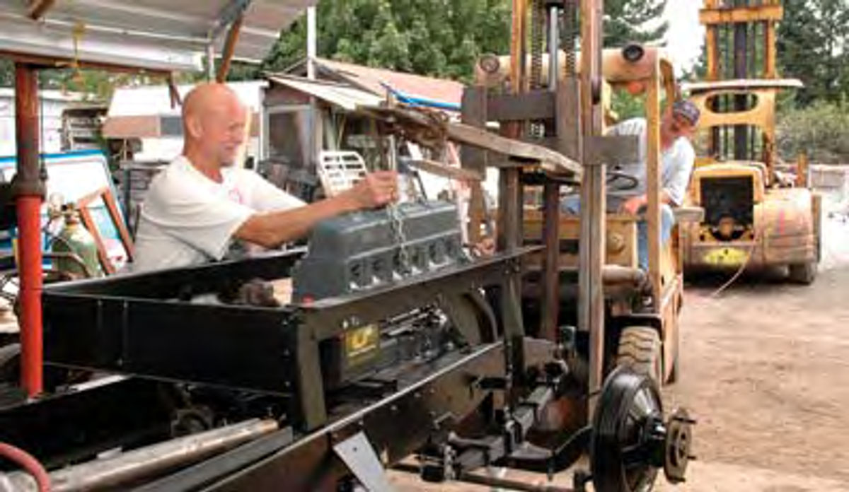 Bolting the 6 cylinder Chevy engine to the truck frame