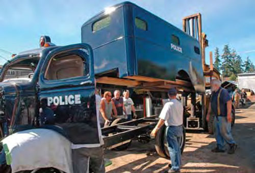 Photo 9. A lift truck was used to place the restored box on the frame.