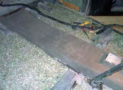 Photo 11. The first part of the floor pan to be carpeted is the drive shaft tunnel. This allows me to bring the floor pan carpeting to the edge of the tunnel and give the carpet a seamless appearance.