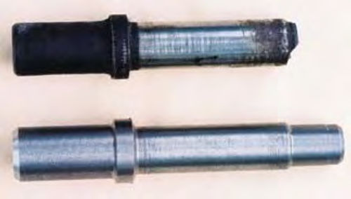 as valve guides and the old and new valve guides are seen in Photo 11 .