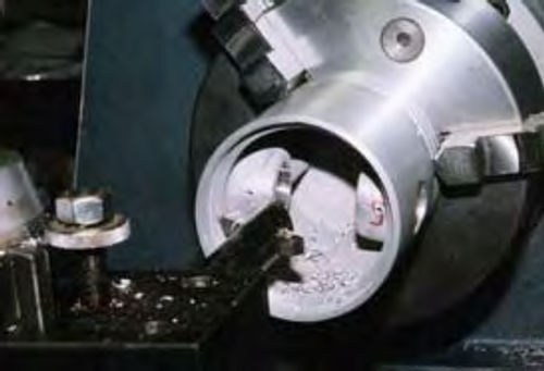 Photo 18. Material is removed from inside the piston to balance it.