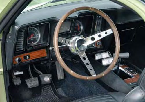 The woodgrain, plated plastic and overall appearance peg its age, but the dashboard is nicely laid out and certainly not unattractive.