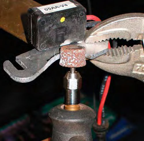 Photo 2: Using a grinding tip on my Dremel tool, I modified the switch base to fit inside the distributor.