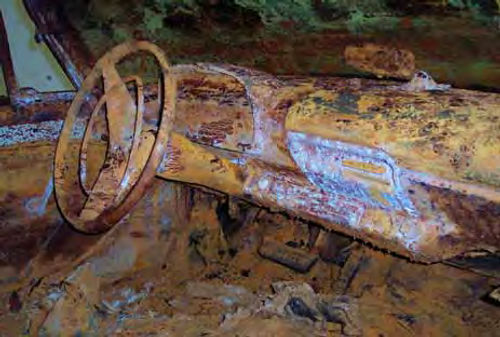 photo shows what decades under water in a vault can do to a car’s interior.