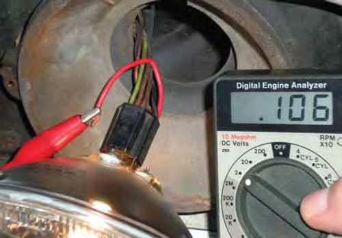 Photo 8. With the headlights on, back probe the socket’s ground connection for a voltage drop.