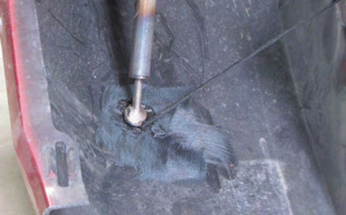 Photo 4. The Eastwood Plastic Welding Kit #50347 is used to weld up this stress crack.