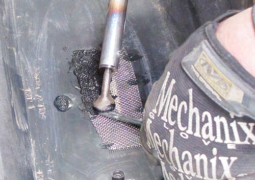 Photo 11. The wire mesh is there to add strength to the repair. (For more on the Mechanix gloves shown here, see page 23 of the December issue.)