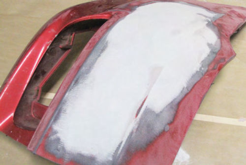 Photo 8. The sanded layer of EZ Sand is covered with a thin layer of plastic body filler.
