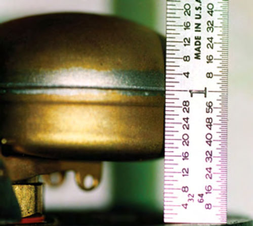 Photo 11 (left). Float height measurement: On Zenith carbs, invert the carburetor top and measure the height from the top surface to the seam. One inch is the specification.