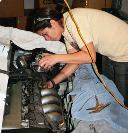 and relocated it to the trunk. She also works on friends’ cars, such as when she cleaned and serviced the intake system on the car on the right. The car had been having “some idle issues,” she said.