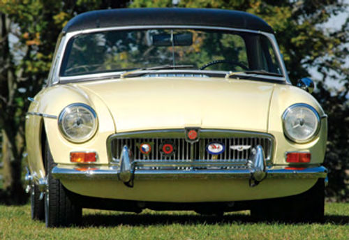 Grille badges, Lucas headlights and wire wheel knock-offs add up to the classic sports car look.