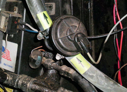 Photo 3. A typical heater control valve mounted in the suction hose.