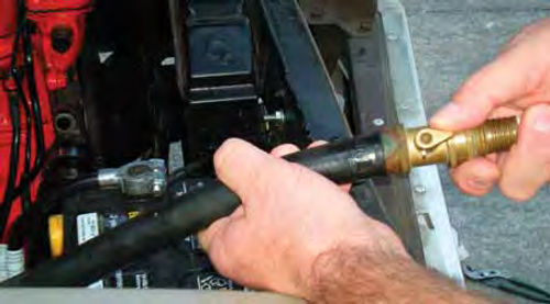 Photo 14. Back-flushing the heater core using a brass nozzle and shut-off valve can often improve    its heat output.