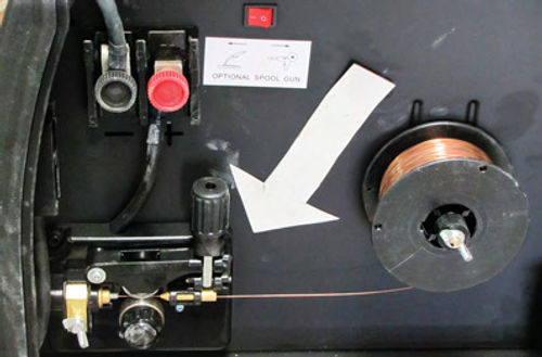 Photo 5. The gun torch cable and the spool assembly both attach to the welder here, at the wire feed roller mechanism.