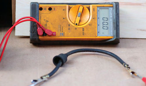 Photo 3. Plug Wire Resistance: Always measure plug wire resistance. “Stranded” wire resistance should read 0 ohms (continuity).