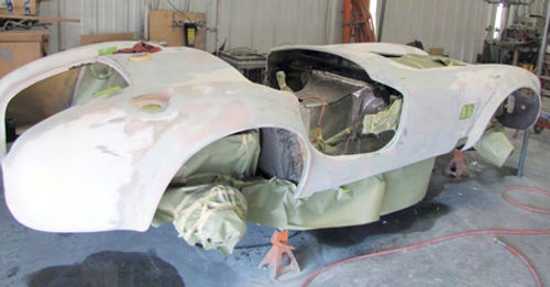 Photo 2. The fiberglass body has had an initial coat of epoxy applied to it and the plastic body filler repairs have been completed.