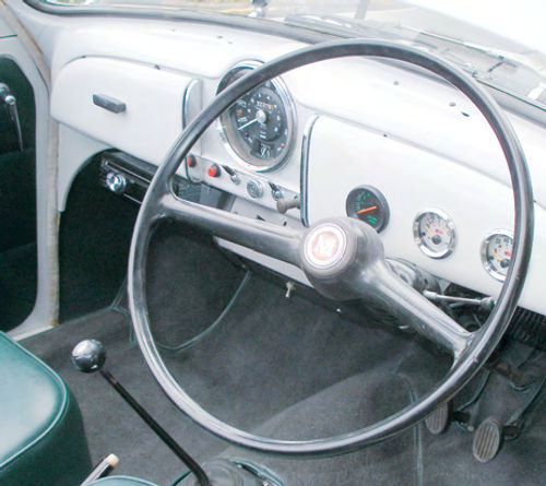 The Morris, too, has only a speedo with idiot lights for oil pressure and amps. The gauges on the right are my addition and consist of a tachometer, oil pressure and temperature gauges. The cramped cockpit makes travel an intimate experience.