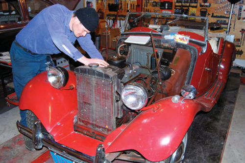 To take the engine and transmission out of an MG TD, you have to take apart most of the interior and front end of the car.