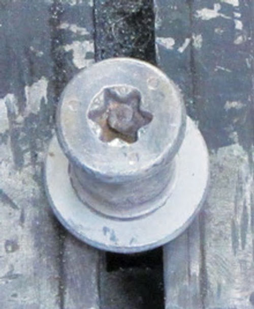 Photo 5. Tamper Proof Torx bolts have a pin located in the center of the female socket. This pin prevents a normal Torx socket from fitting into the socket.