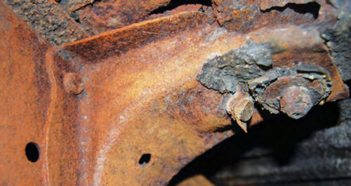 Cars from “Rust Belt” states where salt is used on winter roads can develop rusted body brackets. And this rot didn’t show up until this frame was brushed.