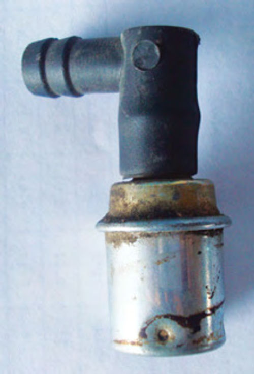 The “up” side of all this smog business, the PCV (positive crankcase ventilation) valve.