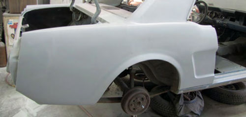 Photo 15. The right quarter panel in primer.