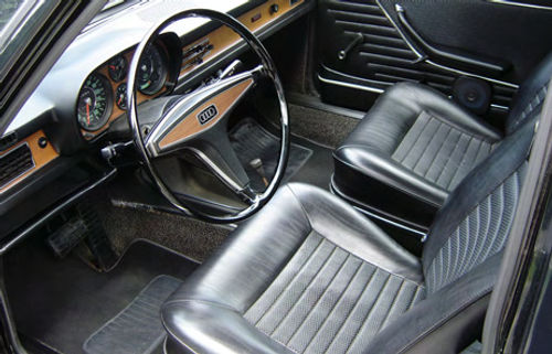 This black interior replaced red seats and door panels to give the 100LS a more formal look. The car also received a modern audio system and a tachometer.