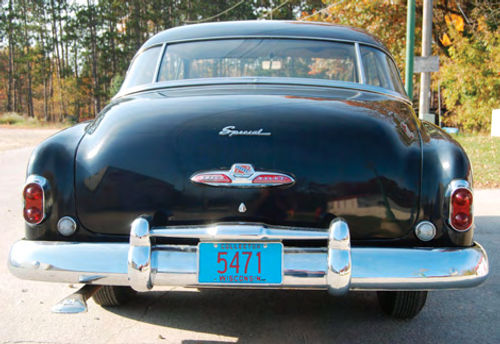 The reflective red finish on the trunk handle shows some aging but the trunk trim is in place, and many old parts were found in there.