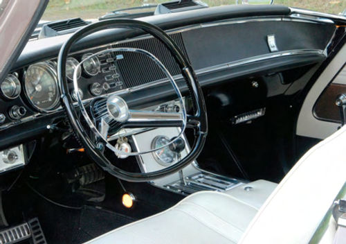 It must have been difficult to slip behind the wheel of the feature car when it was new and then try to walk away without buying. The instrument panel is laid out well and styled to look like it belongs in something fast.