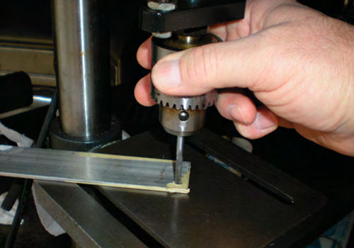 Photo 7. A good method of squaring up a tap is to use a drill press and rotate the chuck by hand.