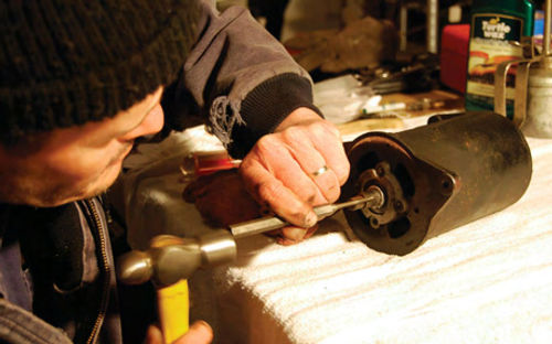 Light tapping with a hammer and punch got the yellow car’s armature to come out of the end plate. This generator looked good and worked, but it was bad inside.