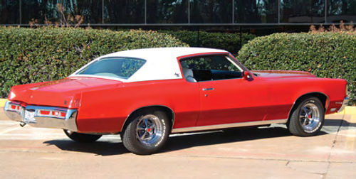 A rear three-quarter view of the Grand Prix provides a good look at the semi-boat tail design of the rear deck and a perspective on the car’s expansive hood area.