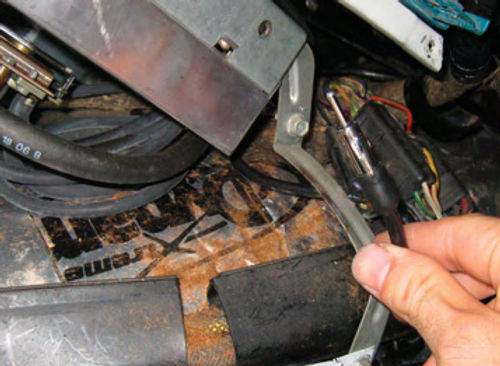 Photo 5. To begin hooking the unit up to your factory radio, you first unplug the vehicle’s antenna wire from the radio. Be sure to inspect it for fraying or corrosion as this can often explain poor reception.