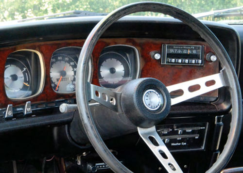 The instrument panel’s woodgrain seems almost conservative in comparison to the rest of the car.