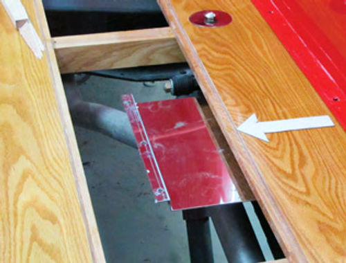 Photo 13. Note the stainless steel heat shield attached to the underside of the floorboard to keep the exhaust heat away from the new floor. Nobody likes the smell of burning oak at 40 miles per hour; pecan maybe, but not oak.