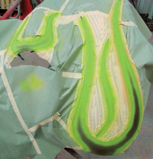 Photo 10. The first color to go on is the green pinstripe color around the edges of the flames.