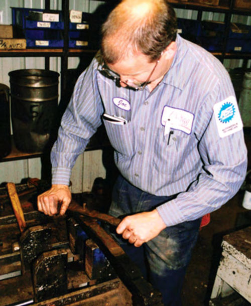 Once Joe Heidemann was provided with spring specs from the factory manual, he started taking the red TD’s springs apart in his big vise.