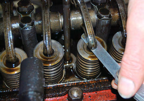 The valves on MG T-series cars can be adjusted using the “rule of nines” described in the text on the previous page. The tappet setting is .019 (early) or .012 (late).