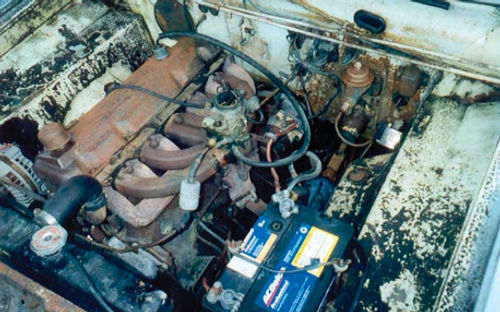 The engine bay on the 1964 Valiant when it arrived from Honolulu.