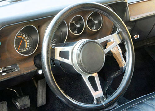 The Charger’s combination of a bench seat and a floor-shifter is part of the Super Bee package.