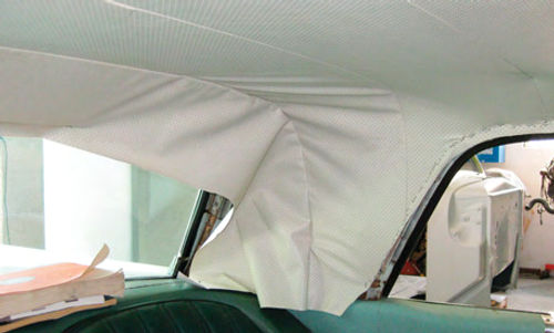 Once your headliner has been attached from back to front you can attach it around the back window and work your way down the sail panels, pulling diagonally to remove the wrinkles.