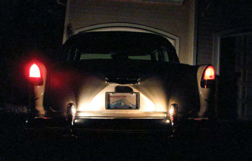 Photo 3. This photo shows the difference between the taillights using halogen bulbs (left) and “bright” incandescent bulbs (right). The difference is even more striking in person.