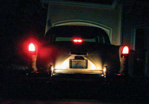 Photo 7. This photo shows the brake lights using a halogen bulb (left) and third brake light. The right taillight has a “bright” incandescent light bulb for comparison.